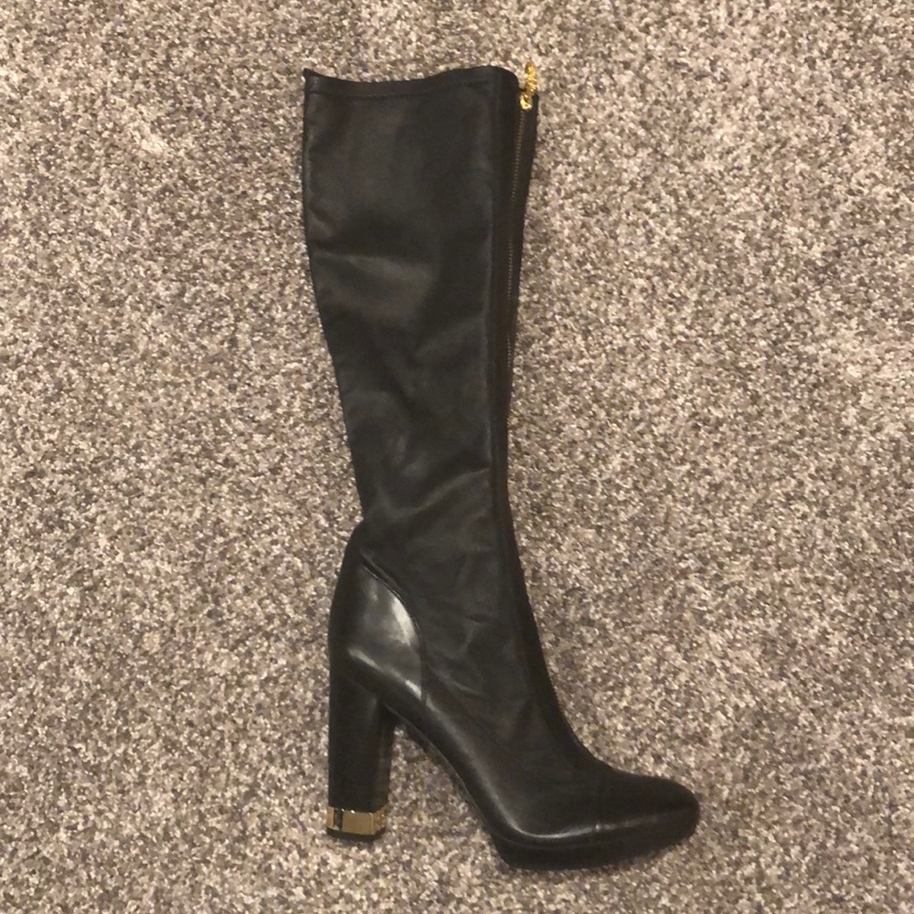 Black leather knee high boots with gold accents